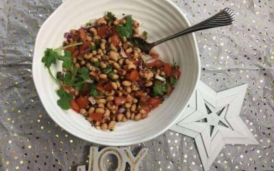 Cranberry Pomegranate Mocktail with a Rosemary Sprig
