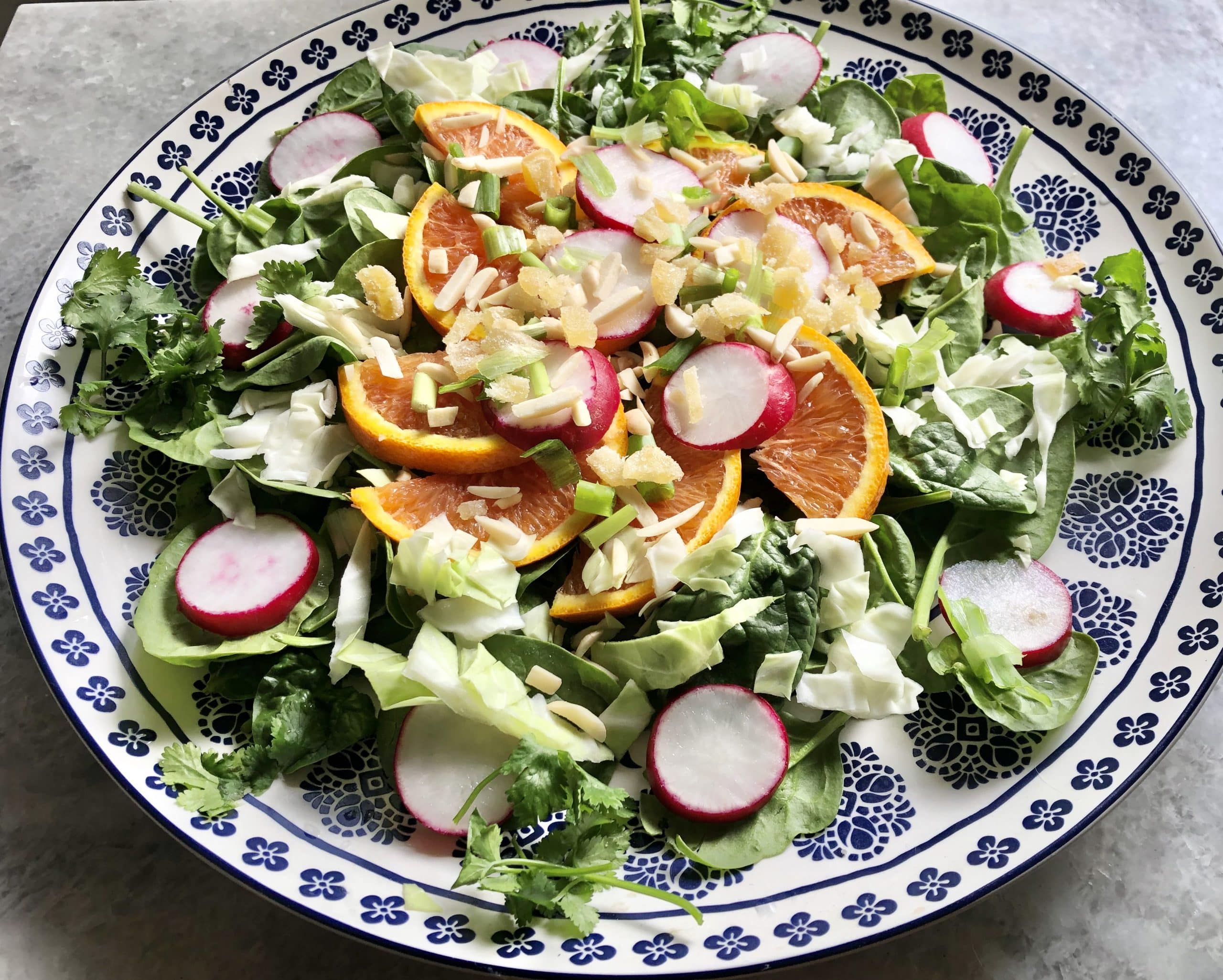 Salad using greens, oranges and radishes