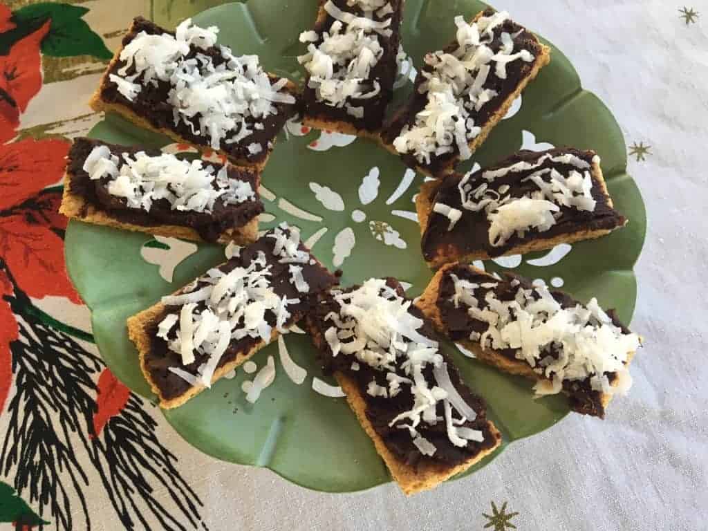 The graham crackers and spread with melted dark chocolate and sprinkled with coconut.