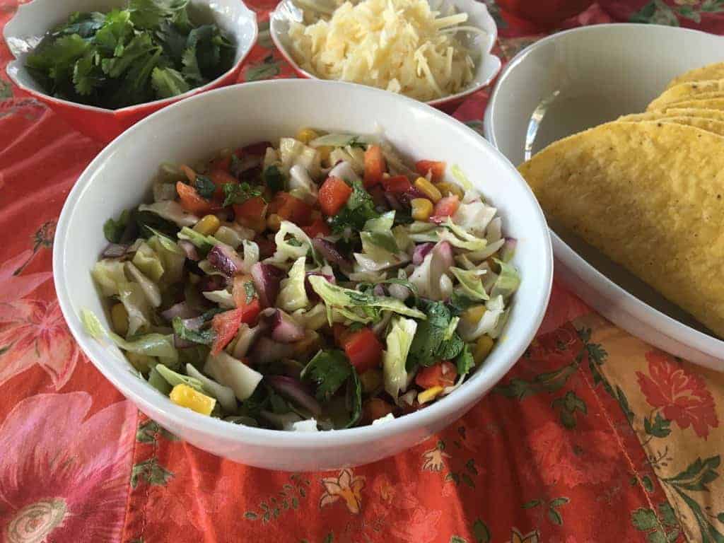 This festive slaw is colorful and delcious to put in the tacos