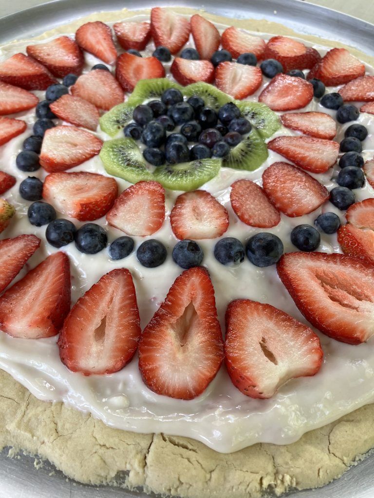 Blueberries, strawberries and kiwi make this healthy fruit pizza delicious!